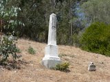 William E. Evans, died 1877,
F & AM emblem on obelisk.
MOTHER, small stone in same plot.
The four corners of the plot are
marked with small granite obelisks.  
